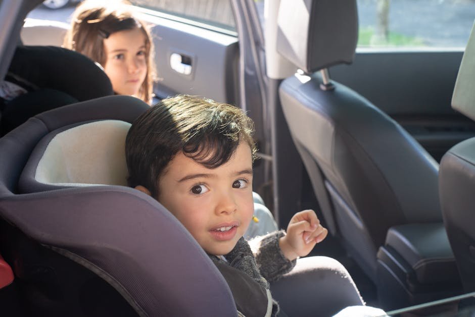 Two children sitting in a car, enjoying a family ride in Portugal.